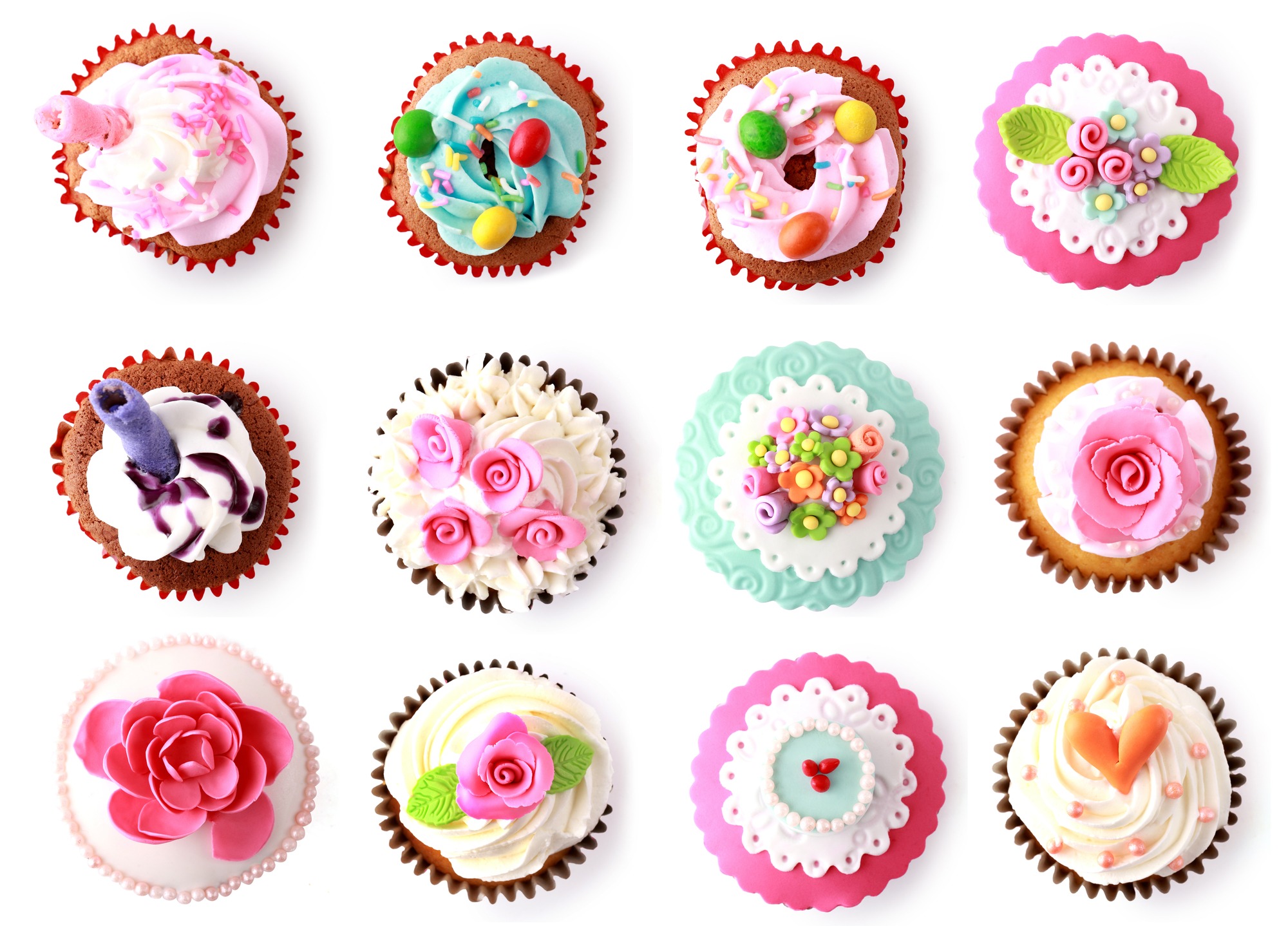 cupcakes with beautiful decoration isolated over white background. Shot from top
